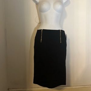 Black fitted skirt with zipper detailing in the front
